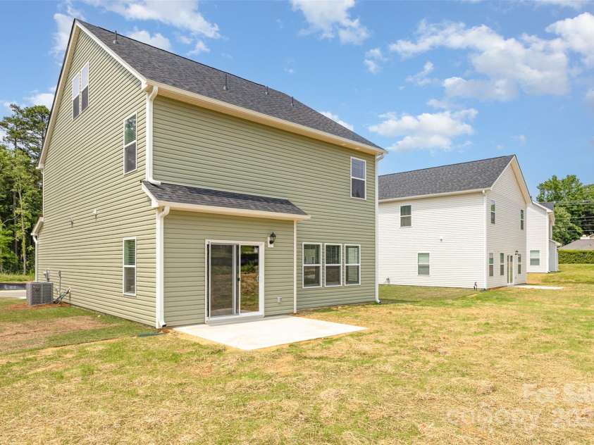 2043 Sadler Woods Lane, Charlotte, NC 28214.  MLS# CAR4265921, YatesRealty ID 17018. Back view of home. Representative Photo