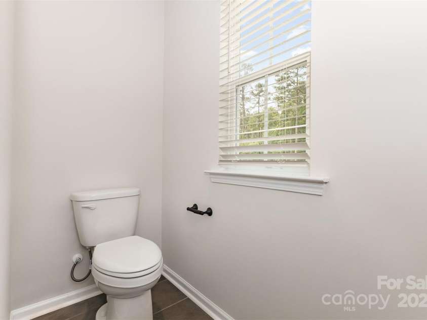 2043 Sadler Woods Lane, Charlotte, NC 28214.  MLS# CAR4265921, YatesRealty ID 17018. Toilet room. Representative Photo.