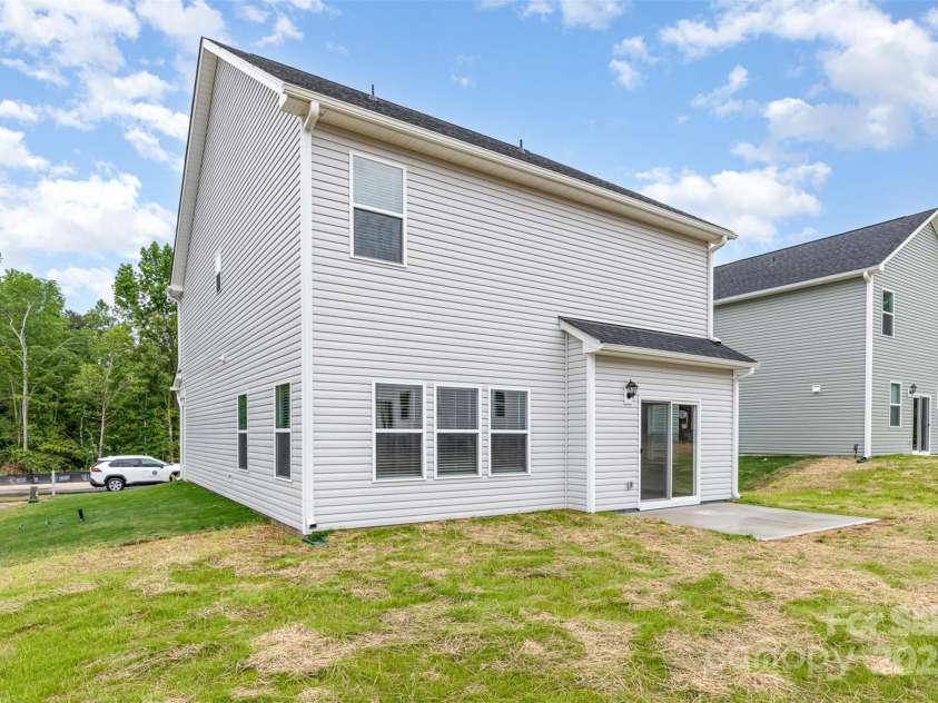 2051 Sadler Woods Lane, Charlotte, NC 28214.  MLS# CAR4265922, YatesRealty ID 17020. Back View of Home. Representational Photo