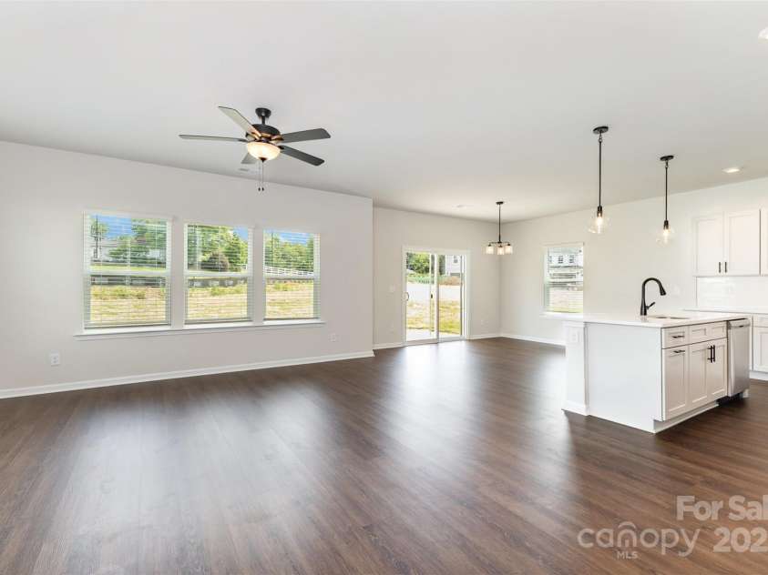 2051 Sadler Woods Lane, Charlotte, NC 28214.  MLS# CAR4265922, YatesRealty ID 17020. SPC flooring throughout 1st floor. Representational Photo