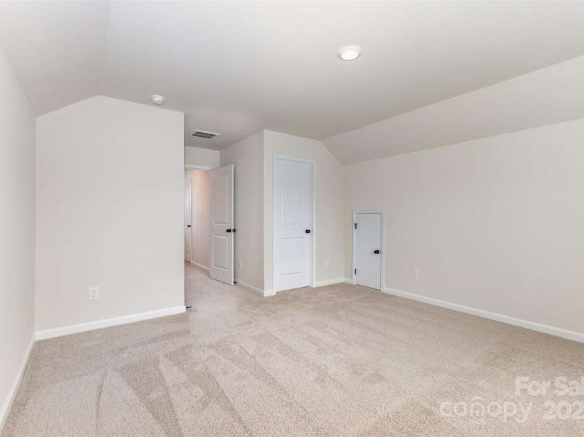 2051 Sadler Woods Lane, Charlotte, NC 28214.  MLS# CAR4265922, YatesRealty ID 17020. Third Floor Bedroom w/ attic access & full bathroom. Representative Photo.