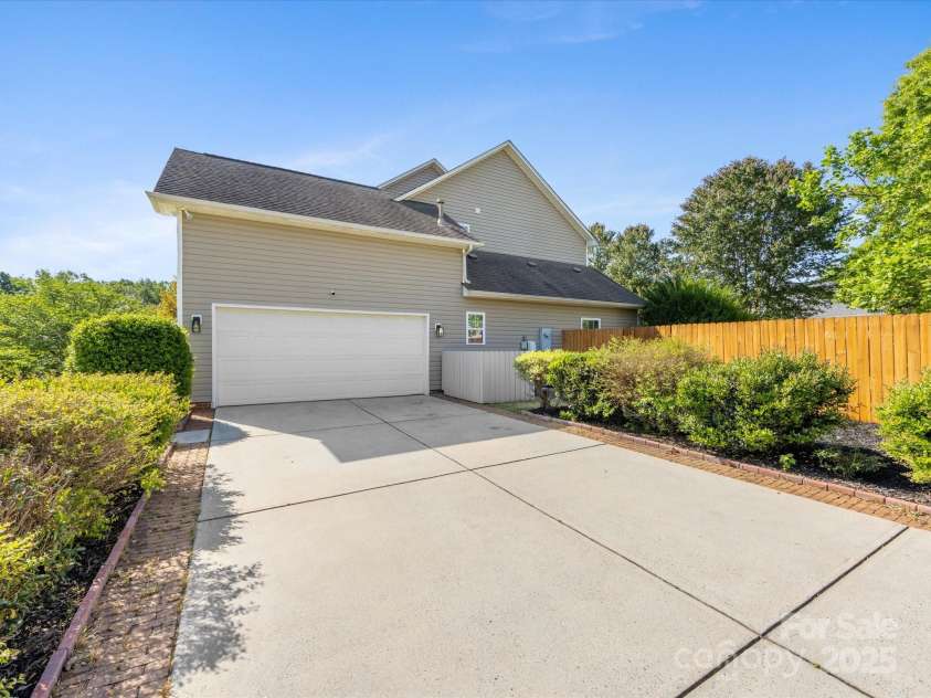 7325 Forrest Rader Drive, Mint Hill, NC 28227.  MLS# CAR4250801, YatesRealty ID 17027. Side load garage