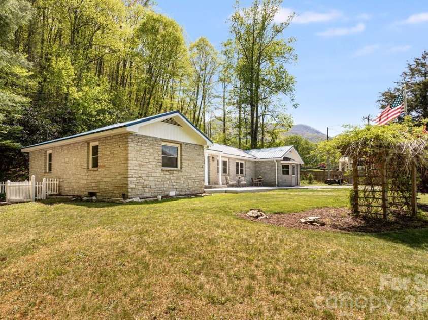 2629 Soco Road, Maggie Valley, NC 28751.  MLS# CAR4374834, YatesRealty ID 17029. Level front yard soaked in sunshine
