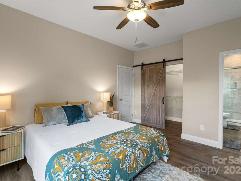 43 Clarks Chapel Extension, Weaverville, NC 28787.  MLS# CAR4258672, YatesRealty ID 17029. Spacious Primary Suite Features a Walk-In Closet and Ensuite Full Bath