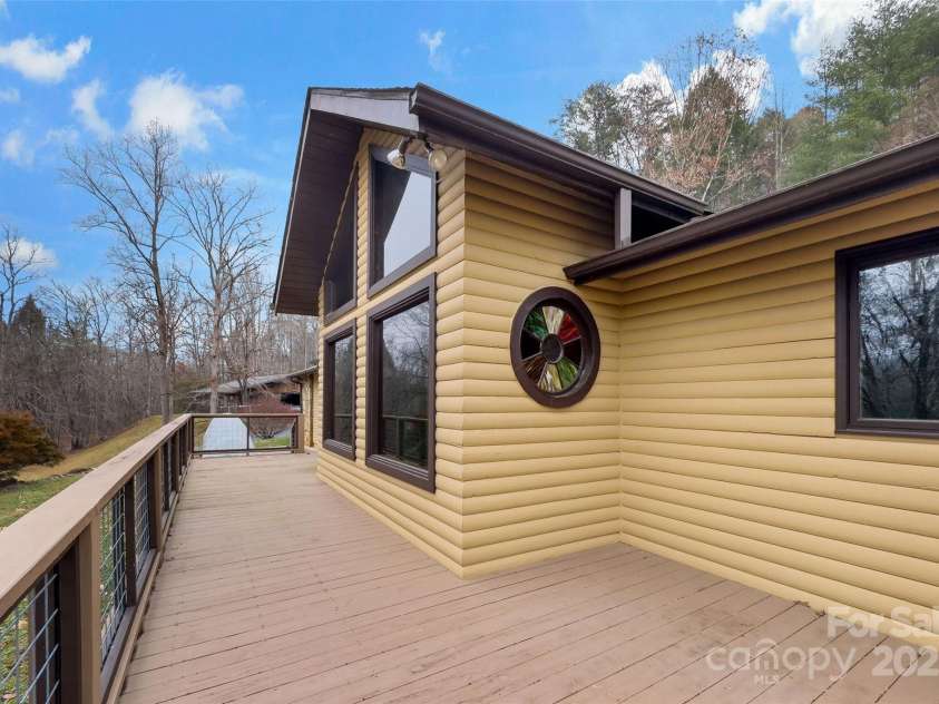 9675 Montford Cove Road, Marion, NC 28752.  MLS# CAR4206983, YatesRealty ID 17032. Large newly resurfaced deck.