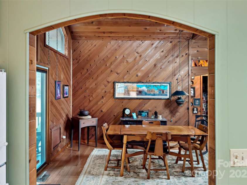 9675 Montford Cove Road, Marion, NC 28752.  MLS# CAR4206983, YatesRealty ID 17032. Looking into the great room/dining room.