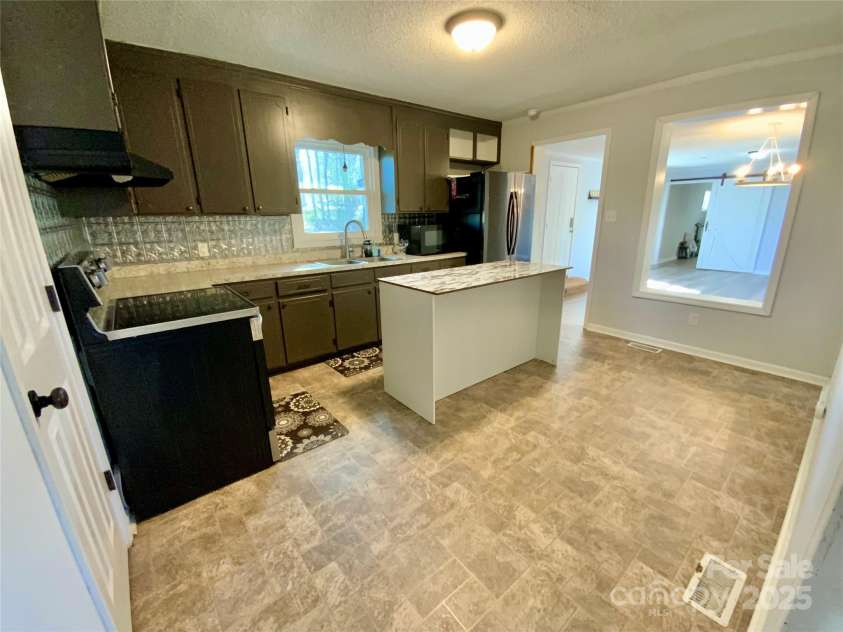 3807 Woodlawn Street, Sharon, SC 29742.  MLS# CAR4233211, YatesRealty ID 17047. Custom built kitchen island is movable