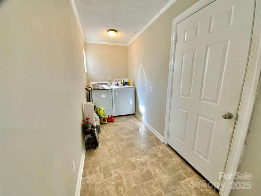 3807 Woodlawn Street, Sharon, SC 29742.  MLS# CAR4233211, YatesRealty ID 17047. Laundry room with garage access