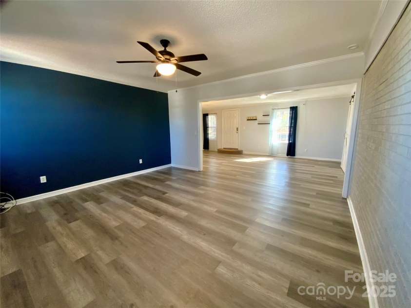 3807 Woodlawn Street, Sharon, SC 29742.  MLS# CAR4233211, YatesRealty ID 17047. Living room with accent wall
