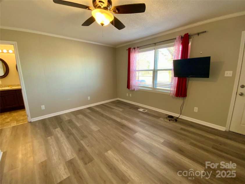 3807 Woodlawn Street, Sharon, SC 29742.  MLS# CAR4233211, YatesRealty ID 17047. Primary bedroom with private exterior door and porch