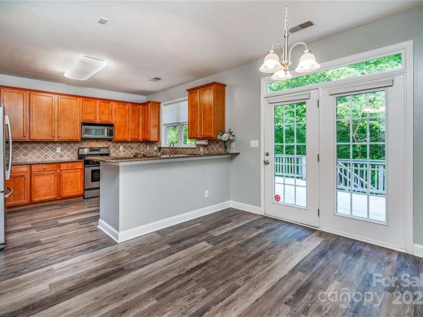 9410 Greenbank Court, Charlotte, NC 28214.  MLS# CAR4262994, YatesRealty ID 17051. Kitchen with Bar Area