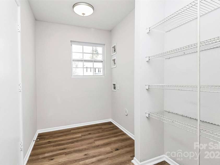 7214 Fox Point Drive, Charlotte, NC 28269.  MLS# CAR4266650, YatesRealty ID 17062. Large laundry room off of garage