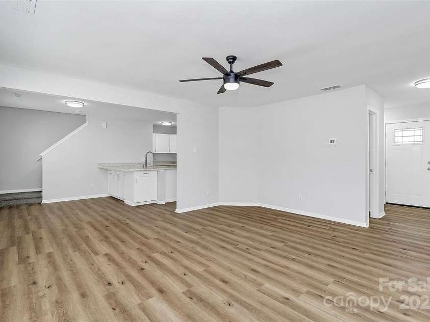 7214 Fox Point Drive, Charlotte, NC 28269.  MLS# CAR4266650, YatesRealty ID 17062. Living area open to kitchen and entrance hallway