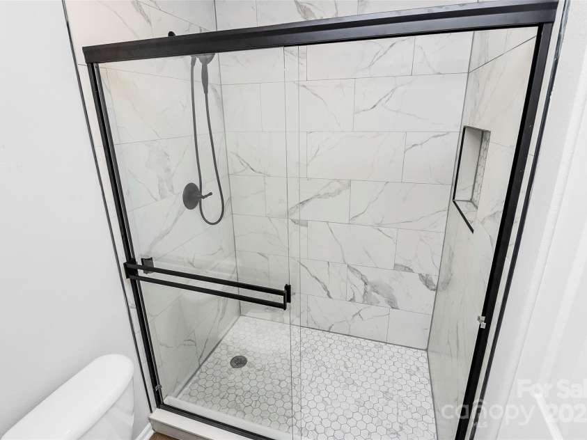 7214 Fox Point Drive, Charlotte, NC 28269.  MLS# CAR4266650, YatesRealty ID 17062. Newly tiled shower in Primary