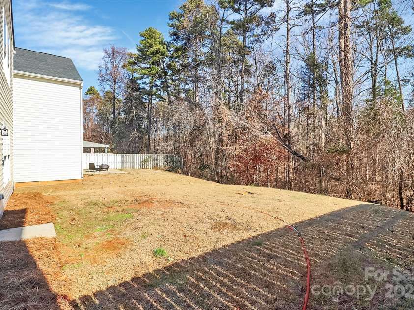 7214 Fox Point Drive, Charlotte, NC 28269.  MLS# CAR4266650, YatesRealty ID 17062. Wooded lot for extra privacy.
