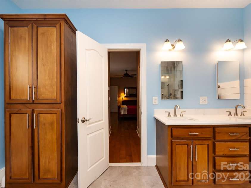 139 Harper Lee Street, Davidson, NC 28036.  MLS# CAR4262722, YatesRealty ID 17063. Primary Bathroom with cherry cabinets and two sinks