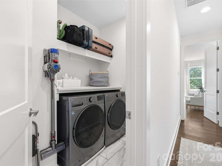 1633 Duckworth Avenue, Charlotte, NC 28208.  MLS# CAR4375706, YatesRealty ID 17071. Laundry room with storage on third level