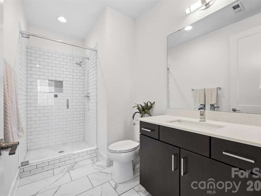 1633 Duckworth Avenue, Charlotte, NC 28208.  MLS# CAR4375706, YatesRealty ID 17071. Lower level en-suite guest bath