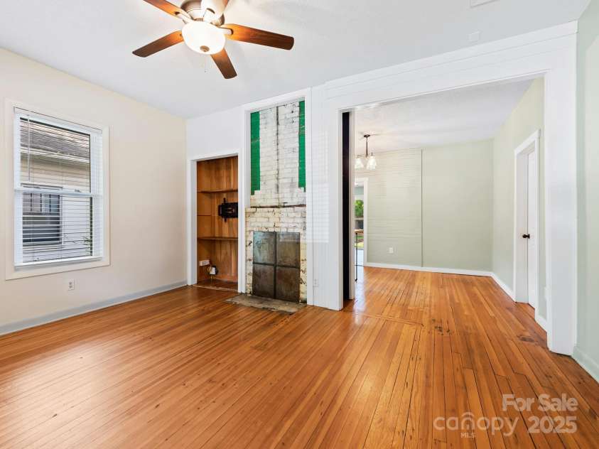 57 Nevada Avenue, Asheville, NC 28806.  MLS# CAR4255023, YatesRealty ID 17080. Living Room w/Fireplace Facade & Hardwood Floors