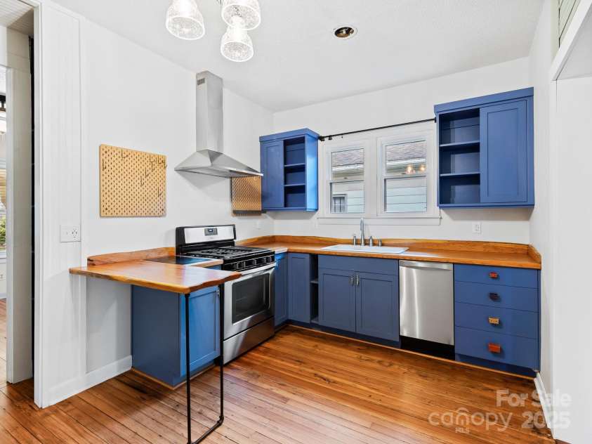 57 Nevada Avenue, Asheville, NC 28806.  MLS# CAR4255023, YatesRealty ID 17080. Red Oak Slab Counters and Stainless Appliances