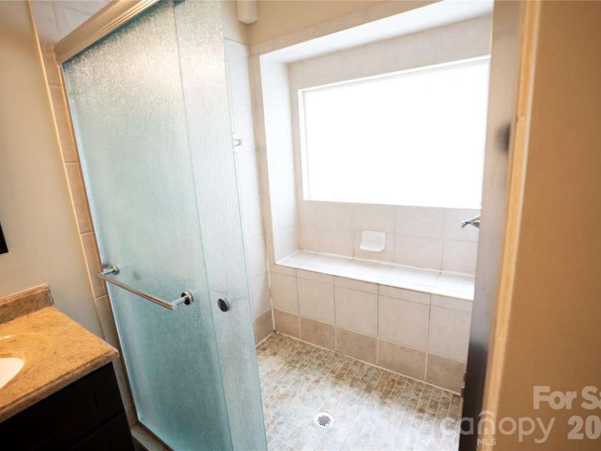 10737 Spruce Mountain Road, Charlotte, NC 28214.  MLS# CAR4368909, YatesRealty ID 17086. Primary shower