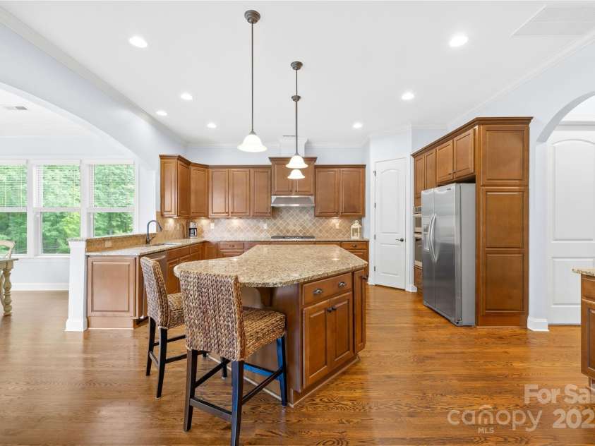 2289 Pine Valley Drive, Denver, NC 28037.  MLS# CAR4263333, YatesRealty ID 17088. Kitchen open to Morning Room and hallway leading to laundry room and 3 car garages