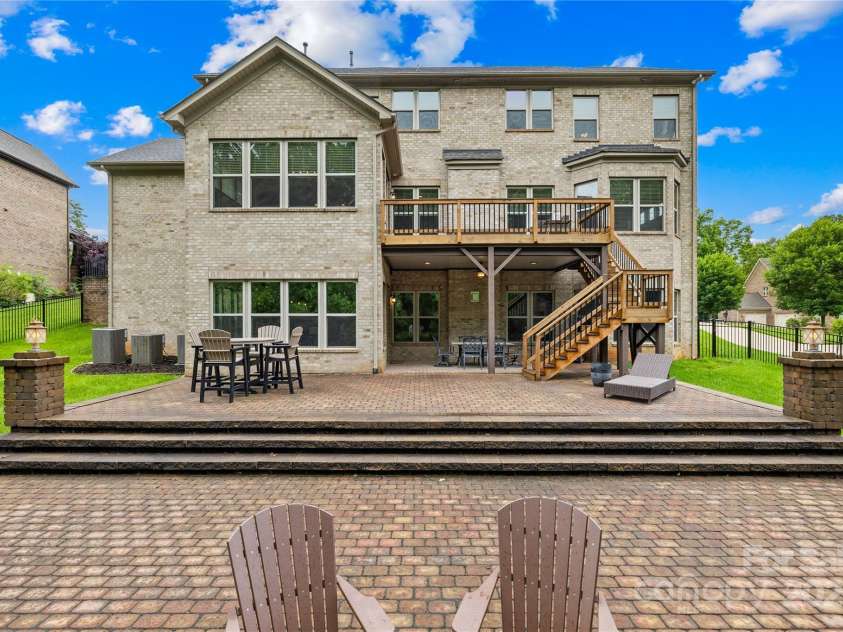 2289 Pine Valley Drive, Denver, NC 28037.  MLS# CAR4263333, YatesRealty ID 17088. Two-tier custom paver patio, covered patio area and fire pit.