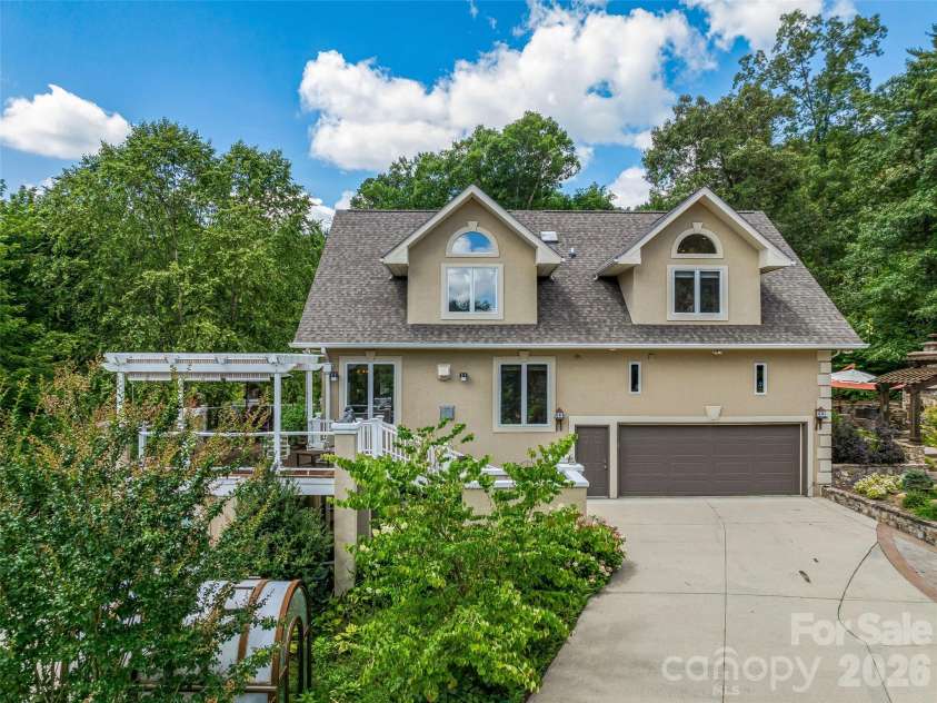 212 Plains Drive, Asheville, NC 28803.  MLS# CAR4373676, YatesRealty ID 17089. Greenhouse and multiple inviting decks