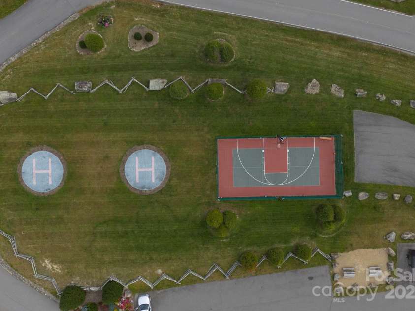 56 Eagle Cottage Lane, Banner Elk, NC 28604.  MLS# CAR4310170, YatesRealty ID 1709. Helipad and court at North Pavilion