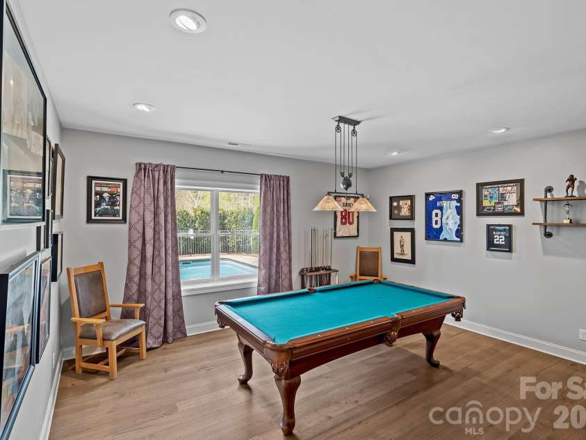 64 Water Hill Way, Fletcher, NC 28732.  MLS# CAR4369957, YatesRealty ID 17110. Billard Area in the Finished Basement