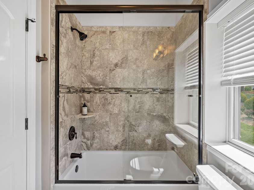 64 Water Hill Way, Fletcher, NC 28732.  MLS# CAR4369957, YatesRealty ID 17110. Custom Tiled Shower in the Main Bath