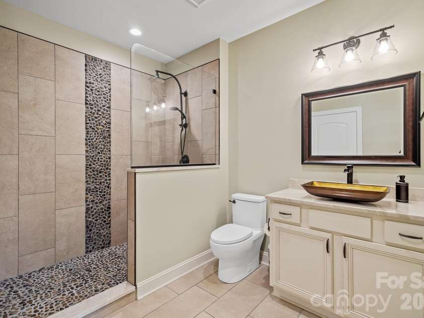 64 Water Hill Way, Fletcher, NC 28732.  MLS# CAR4369957, YatesRealty ID 17110. Upscale Bath in the Finished Basement