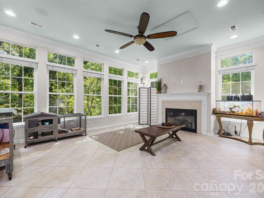 2201 Trading Ford Drive, Waxhaw, NC 28173.  MLS# CAR4374708, YatesRealty ID 17111. Sunroom with fireplace