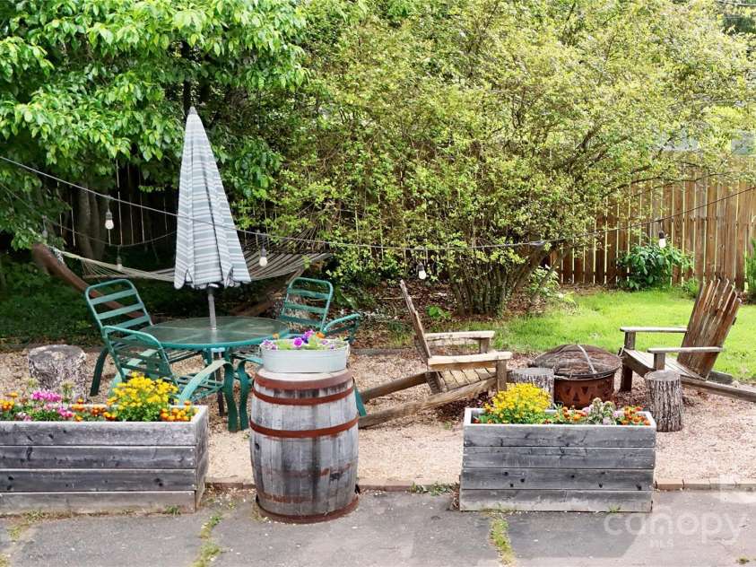 1 Fullam Drive, Arden, NC 28704.  MLS# CAR4263674, YatesRealty ID 17133. Outside sitting area with firepit
