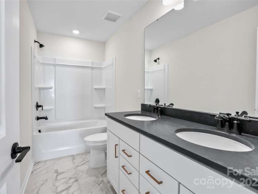 15004 Meadows Hunt Lane, Huntersville, NC 28078.  MLS# CAR4256017, YatesRealty ID 17147. Secondary Bathroom