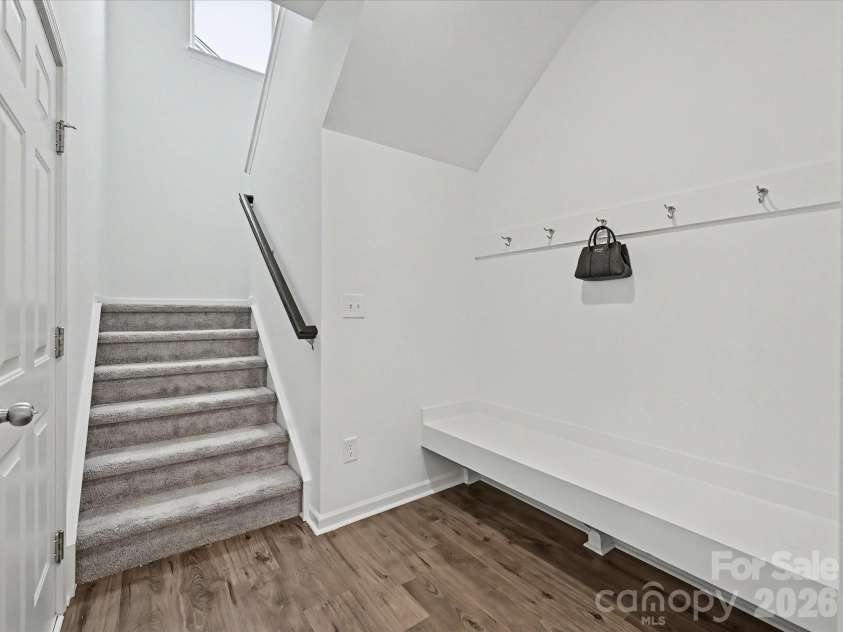 5125 Arbordale Way, Mount Holly, NC 28120.  MLS# CAR4353356, YatesRealty ID 17157. Functional drop zone with built-in bench and hooks for organization, conveniently located beside the staircase leading to the upper level.