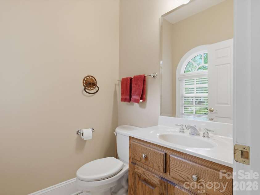 1215 Rosa Drive, Monroe, NC 28112.  MLS# CAR4366917, YatesRealty ID 17172. 2nd half bath in hallway near garages.