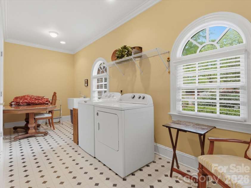 1215 Rosa Drive, Monroe, NC 28112.  MLS# CAR4366917, YatesRealty ID 17172. Laundry room with sink and closet storage.