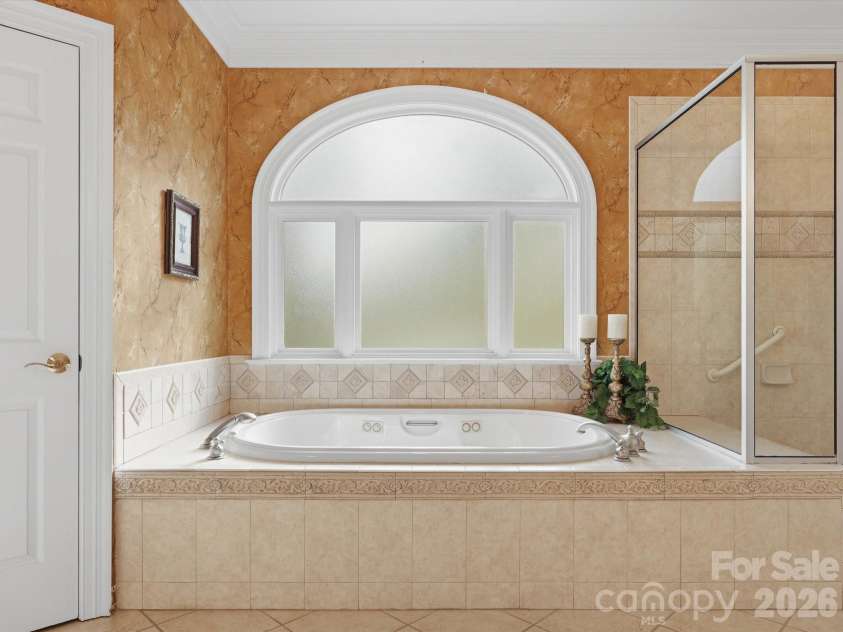 1215 Rosa Drive, Monroe, NC 28112.  MLS# CAR4366917, YatesRealty ID 17172. Soaking tub with jets, separate shower with bench.