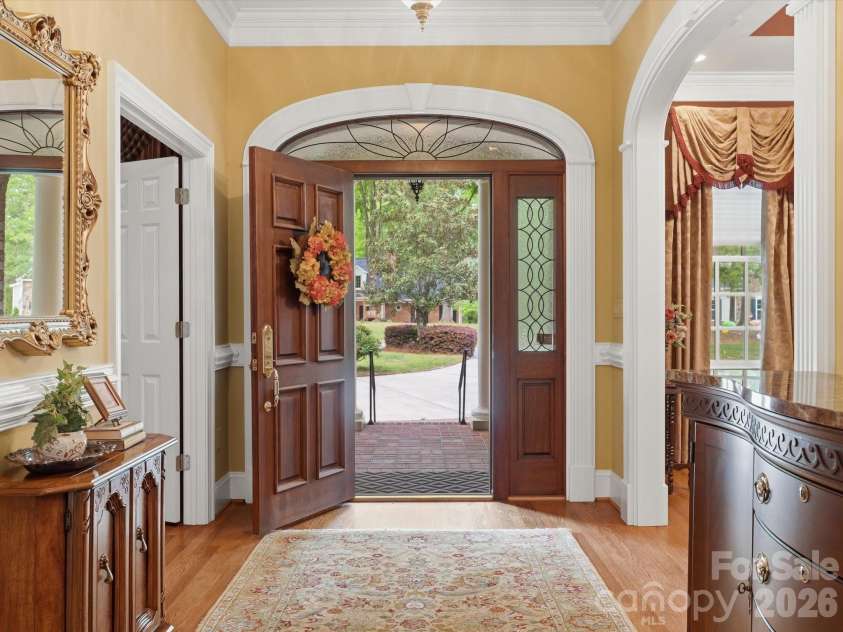 1215 Rosa Drive, Monroe, NC 28112.  MLS# CAR4366917, YatesRealty ID 17172. Solid wood entrance door/ transom window with leaded glass inserts