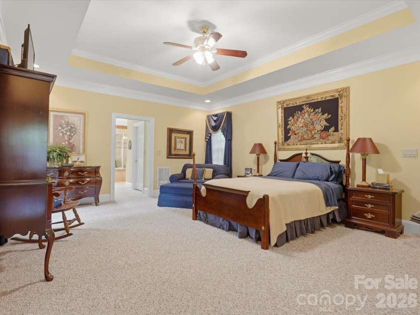 1215 Rosa Drive, Monroe, NC 28112.  MLS# CAR4366917, YatesRealty ID 17172. Spacious Primary Bedroom with Tray ceiling.