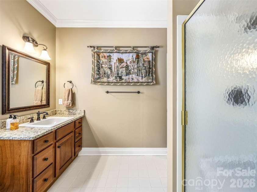 33 Tiverton Lane, Asheville, NC 28803.  MLS# CAR4370215, YatesRealty ID 17174. There is a second full bathroom on the main level.
