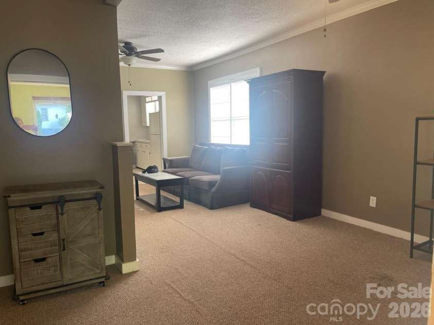 119 Pine Street, Badin, NC 28009.  MLS# CAR4374357, YatesRealty ID 17177. Living Room
