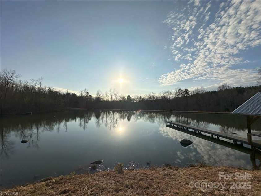 2117 Slate Mine Road, Denton, NC 27239.  MLS# CAR4220730, YatesRealty ID 17181. Fully engineered 2+ acre pond, 20+ft deep with aerators and feeders to support the smallmouth bass, brim and shellcracker habitat.
