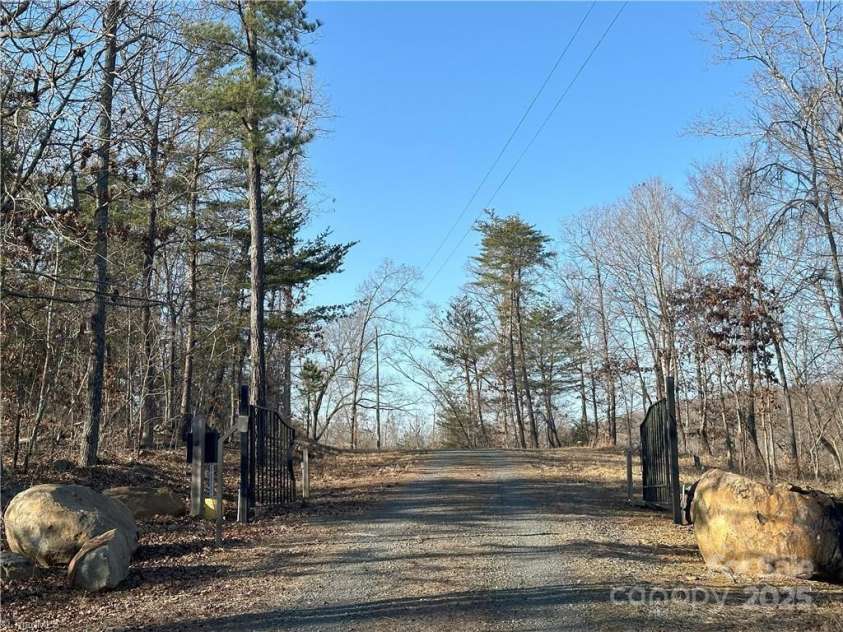 2117 Slate Mine Road, Denton, NC 27239.  MLS# CAR4220730, YatesRealty ID 17181. Gated entrance with keypad - actuator in need of repair.