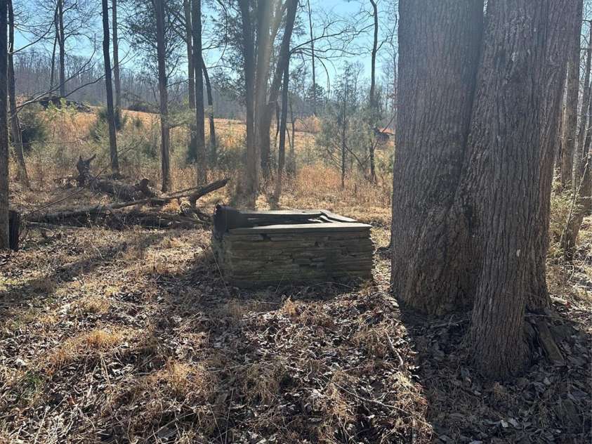 2117 Slate Mine Road, Denton, NC 27239.  MLS# CAR4220730, YatesRealty ID 17181. Old slate well near the old slate chimneys