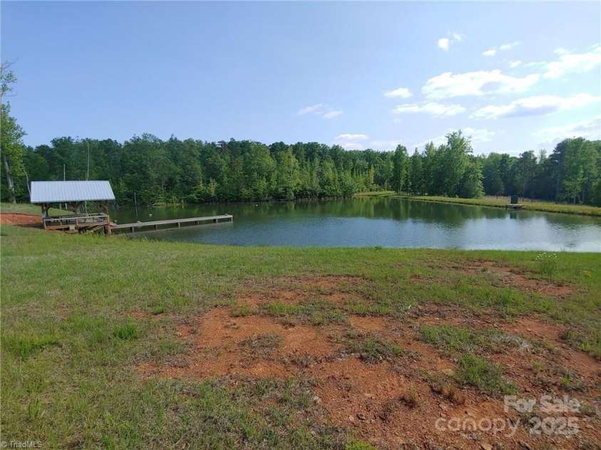 2117 Slate Mine Road, Denton, NC 27239.  MLS# CAR4220730, YatesRealty ID 17181. Pond - fully engineered 2+ acre, 20+ft deep with aerators and feeders to support the smallmouth bass, brim and shellcracker habitat.