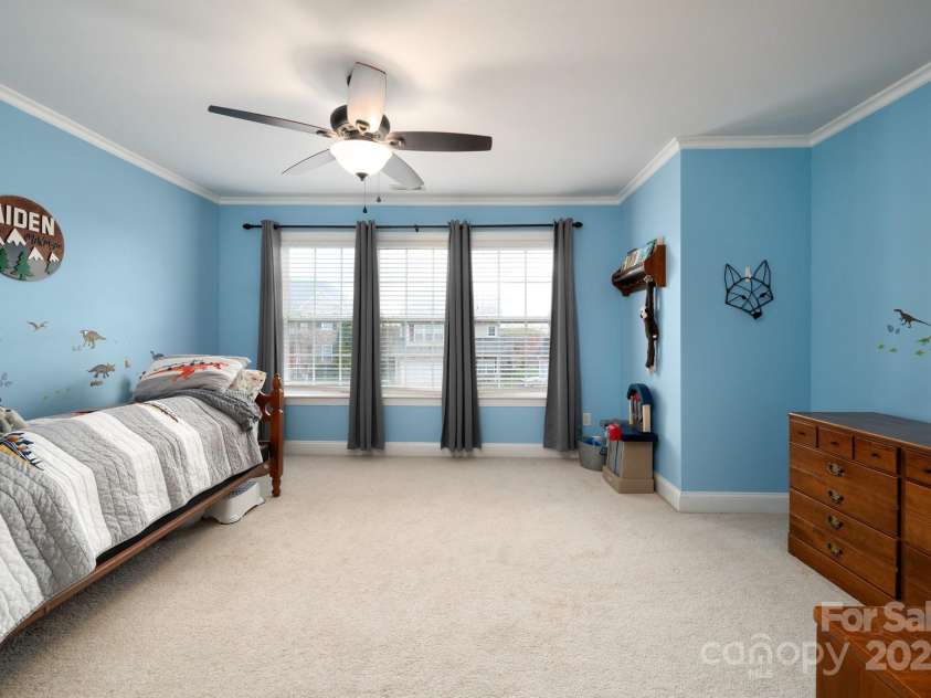 11 Dansford Lane, Arden, NC 28704.  MLS# CAR4295929, YatesRealty ID 17185. Bedroom with Carpet and Crown Molding