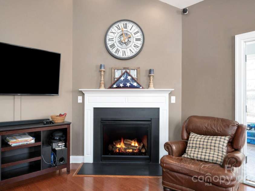 11 Dansford Lane, Arden, NC 28704.  MLS# CAR4295929, YatesRealty ID 17185. Cozy Fireplace with Stately Mantle