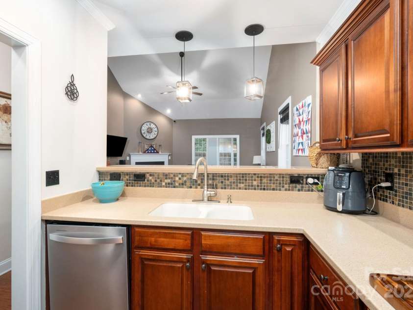 11 Dansford Lane, Arden, NC 28704.  MLS# CAR4295929, YatesRealty ID 17185. Entertain Your Guests with Convenient Pass-Through Bar